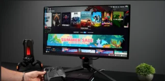 YouTuber Installs SteamOS on $4000 AMD Ryzen AI Halo Workstation Desktop gaming setup with a monitor running SteamOS, a black AMD Ryzen AI mini PC, and a controller.
