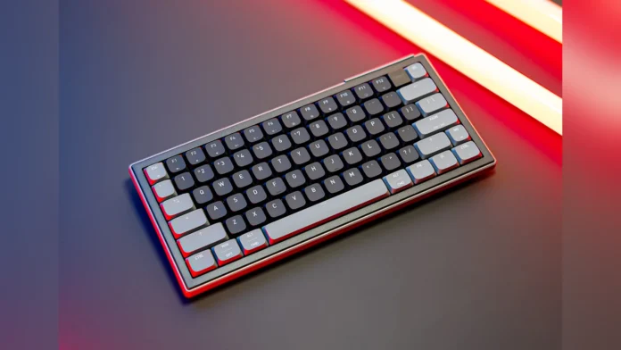 The Cherry Xtrfy K63W Pro Compact gaming keyboard angled on a desk with glowing red and orange backlights.