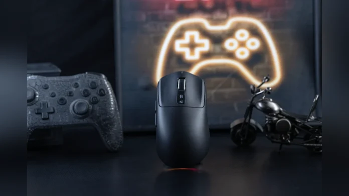 The black Epomaker Nex Lite wireless gaming mouse standing on a dark desk with gaming controllers.