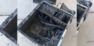 CS2 Streamer Allegedly Destroys Graphics Card with Grenade Explosion A 16:9 padded layout showing a completely burned out computer chassis with charred motherboards and melted power cables lying on a concrete floor.