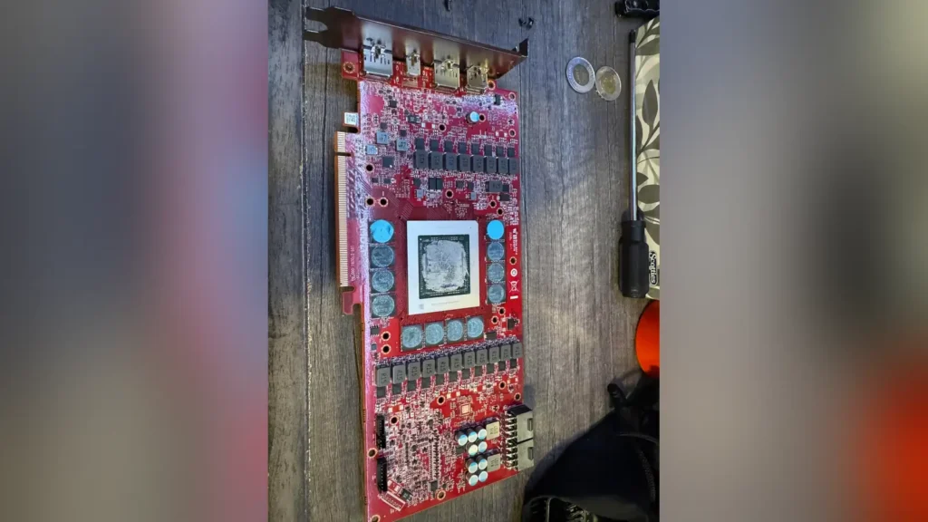 Redditor Discovers Radeon RX 7900 XTX Engineering Prototype 1 Front layout of the red PCB AMD Radeon RX 7900 XTX prototype graphics card.