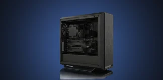 Slimbook Launches Nexus AI Workstation Series Front angled view of the isolated black Slimbook Nexus AI workstation chassis showing its internal components and dual GPUs on a steel blue gradient backdrop.