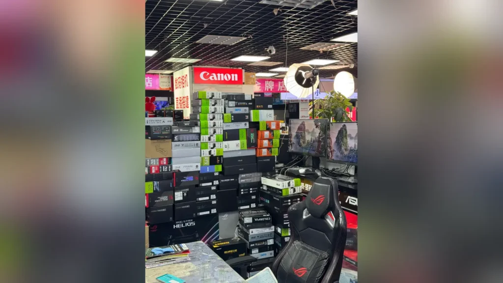 GeForce RTX 5090 and Ryzen 7 9800X3D Sell Without Fixed Prices in China 1 Flagship GeForce RTX 5090 graphics card boxes stacked on a concrete shop floor in Chengdu.