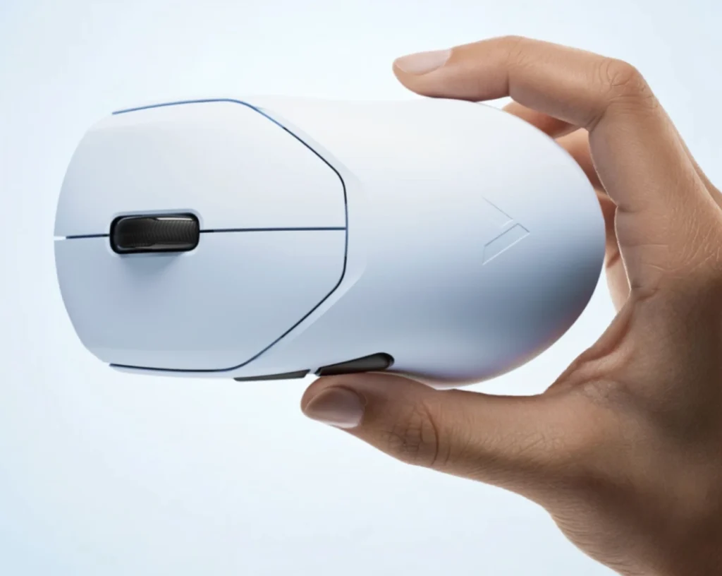 Rapoo Releases VT9s Air MAX V2 With PAW3955 Sensor and Dual 8K Polling 2 Hand holding the VT9S Air MAX V2 wireless gaming mouse, highlighting its ergonomic shape, matte white finish, and side buttons.