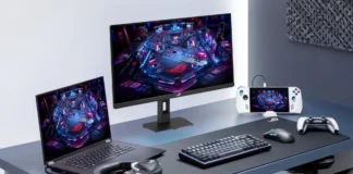 ASUS Releases ROG Strix XG259QNSR Ace Monitor With 420Hz Fast IPS Panel ASUS ROG Strix XG259QNSR Ace gaming monitor in a desktop setup with a gaming laptop, handheld console, keyboard, mouse, headset, and controller.