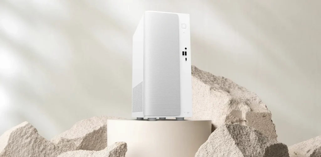 ASUS V500 Mini Tower white desktop PC displayed on a pedestal with a minimalist studio-style background.