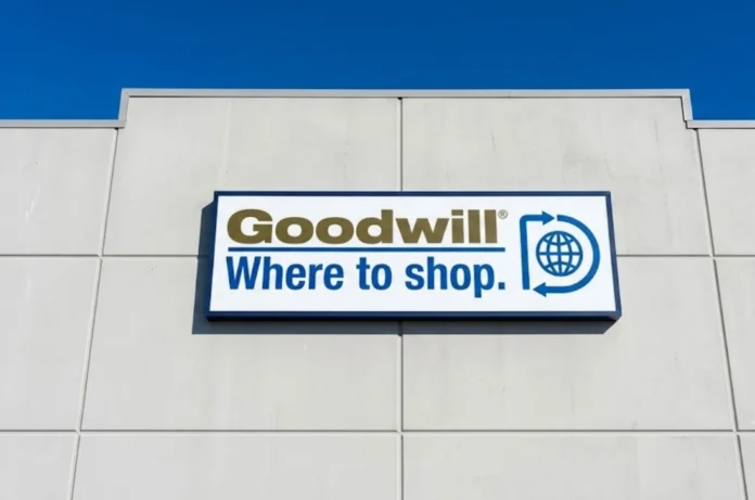 Goodwill storefront sign alongside a rare Steam Controller discovered at a thrift store, highlighting an unexpected gaming hardware find for collectors and PC gaming enthusiasts.