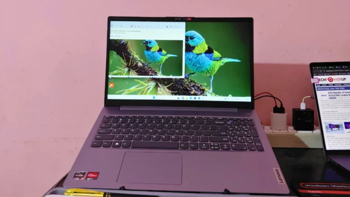 Lenovo laptop running Windows 11 displaying a screenshot example on the screen while connected to an external device