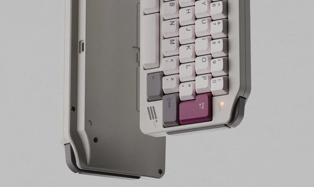KeyBoy Advance Keyboard Opens Group Buy at $275 2 Light gray KeyBoy Advance mechanical keyboard with white keycaps and a magenta Enter key.