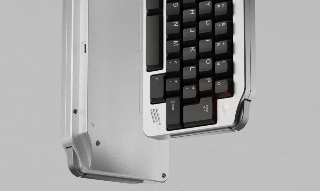 KeyBoy Advance Keyboard Opens Group Buy at $275 1 Silver aluminum KeyBoy Advance mechanical keyboard with black keycaps and retro-inspired handheld styling.