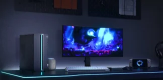Lenovo Releases GeekPro gaming Desktop Mobile Core 7-245HX With RTX 5060 for $1,470 Lenovo GeekPro gaming desktop connected to an ultrawide monitor with RGB lighting, mechanical keyboard, mouse, and handheld gaming device.