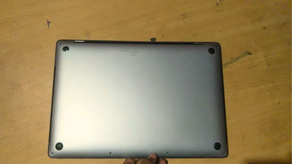 I Bought a Renewed MacBook Pro 16-inch (2019) for Under $500 7 Bottom panel of the renewed MacBook Pro 16-inch (2019) showing the rubber feet and screws