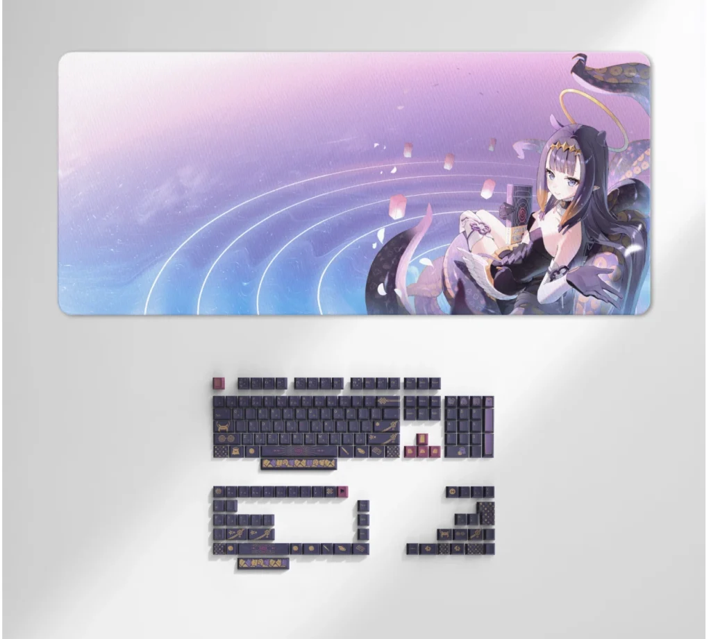 HYTE Launches Ninomae Ina'nis Y70 Touch Infinite With Custom hololive Design and Keycap Set 5 Ninomae Ina'nis themed deskmat displayed alongside the matching mechanical keyboard keycap set.