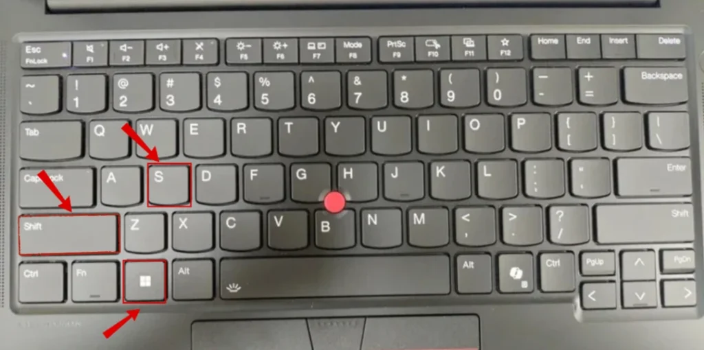 How to Take a Screenshot on a Lenovo Laptop (Windows 10 & 11) 5 Keyboard highlighting the Windows, Shift, and S keys used to open the Snipping Tool screenshot overlay in Windows