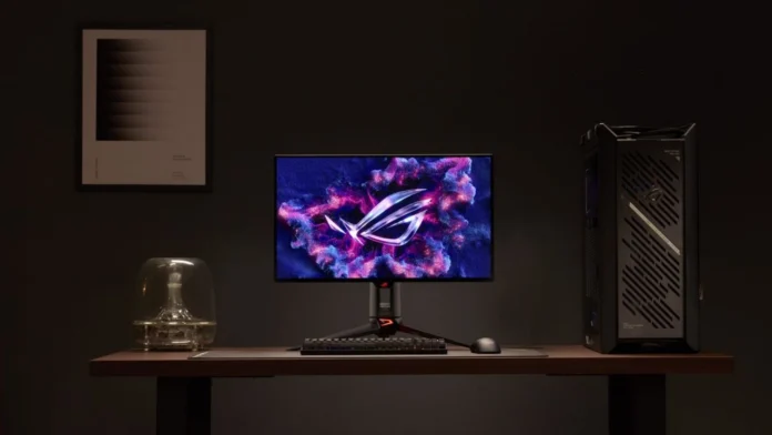 ASUS ROG Swift OLED PG27UCWM monitor displayed in a gaming desktop setup with an ROG gaming PC.