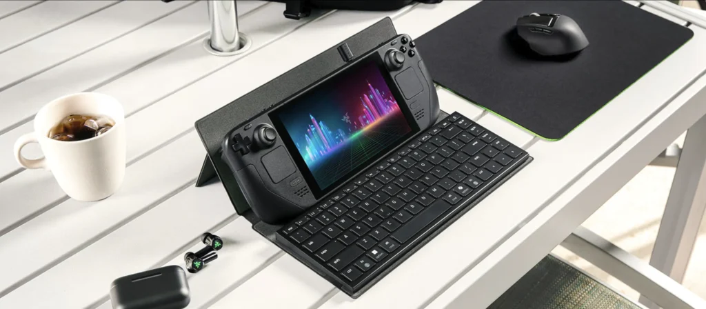 Handheld gaming console supported by the Razer Travel Case Folio with a compact keyboard and wireless mouse.