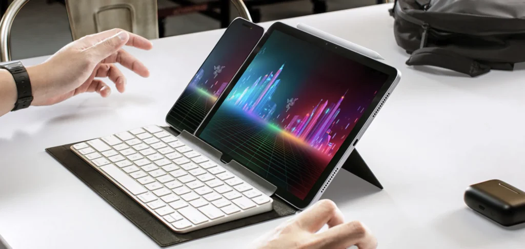 Tablet and smartphone mounted on the Razer Travel Case Folio with a compact wireless keyboard.