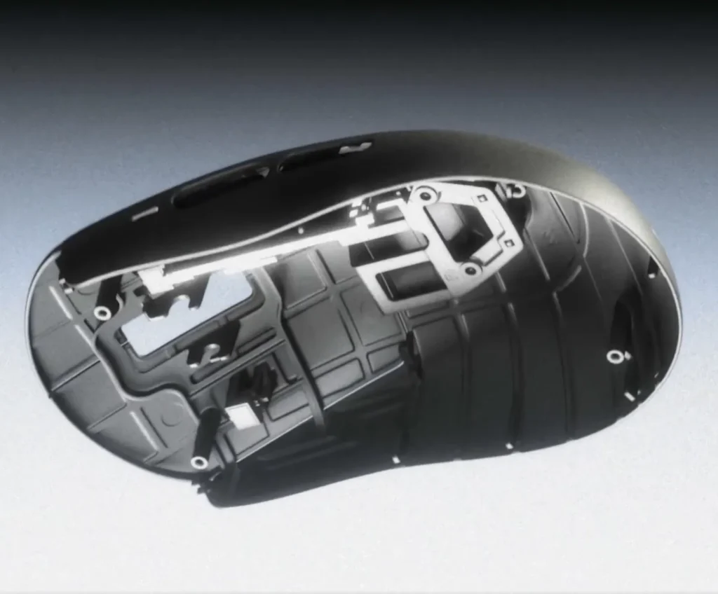 Wallhack M-001 Teased With Swappable Battery and Charging Dock 2 Bottom view of the Wallhack M-001 gaming mouse showing its lightweight internal shell and skate layout.