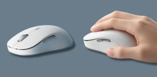 Xiaomi Wireless Mouse 4 Pro Goes on Sale July 7 for 199 Yuan Xiaomi Wireless Mouse 4 Pro in white shown alongside a hand demonstrating its ergonomic shape and comfortable grip.